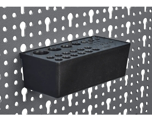 Držiak nástrojov pre dierovanú stenu na uloženie vrtákov