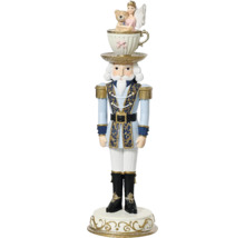 Dekoratívna figúrka luskáčika s šálkou a hračkami