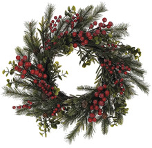 Dekoratívny vianočný veniec s červenými bobuľami a vetvami jedle.