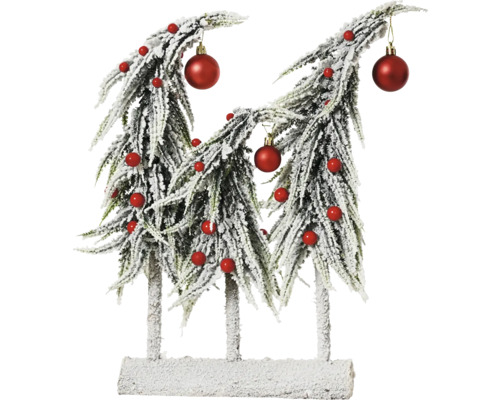 Dekoratívny vianočný stromček s červenými guľami ako dekorácia na stôl