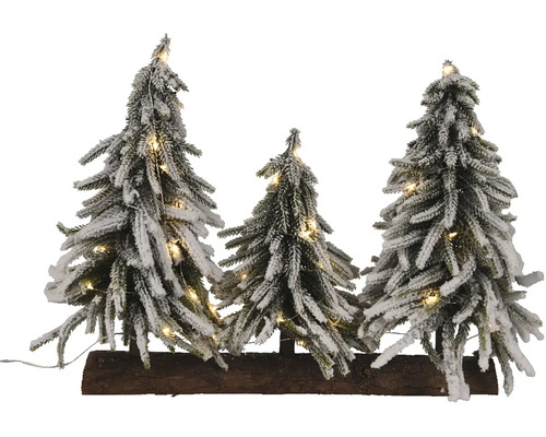 Dekoratívna zasnežená skupina vianočných stromčekov s osvetlením na drevenom podstavci na vianočné obdobie.