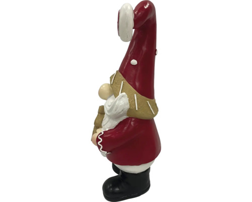 Záhradný trpaslík s červenou čiapkou a čiernymi topánkami