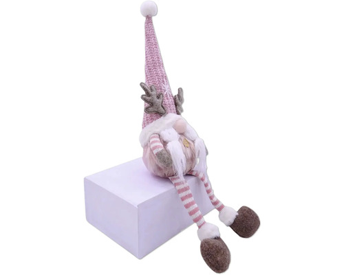 Dekoratívny vianočný škriatok s čiapkou, bradou a parožím sedí na kocke