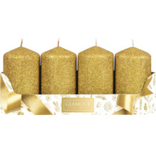 Štyri zlaté stĺpové sviečky v dekoratívnom balení.