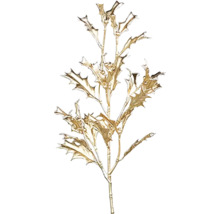 Dekoratívna zlatá vetva s listami ako dekorácia interiéru