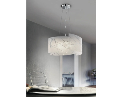 Sklenené závesné svietidlo s geometrickým vzorom nad jedálenským stolom