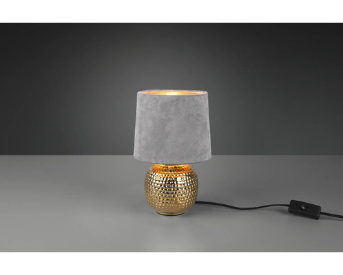 Dekoratívna stolná lampa s tienidlom a zlatou základňou