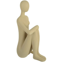 Dekoratívna figúrka sediacej, štylizovanej ženy