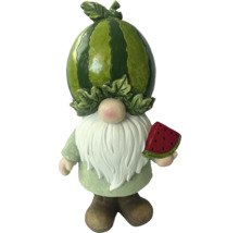 Záhradný trpaslík s melónom ako hlavou a melónom v ruke