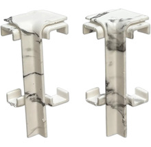 Dva rohové konektory z plastu s mramorovým vzhľadom na použitie na paneloch