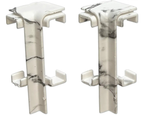 Dva rohové konektory z plastu s mramorovým vzhľadom na použitie na paneloch