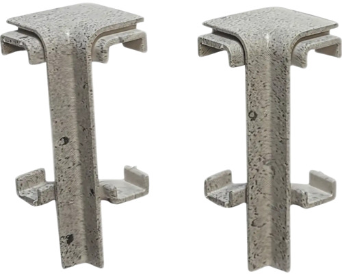 Dva rohové konektory z plastu pre okraje trávnika