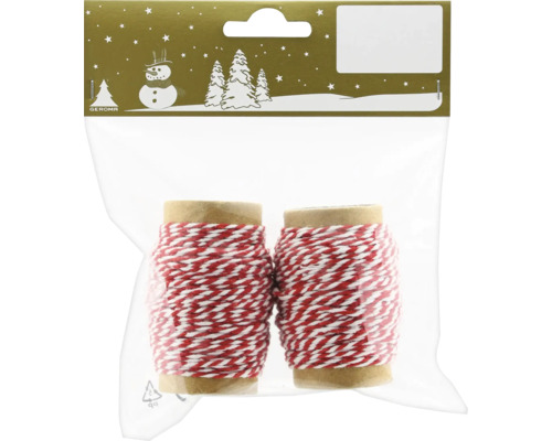 Dve rolky červeno-bielej ozdobnej stuhy v balení