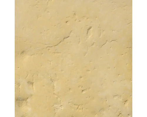 Zámková dlažba BRAD OLDTOWN 7 cm piesková Nažltlá stena s nerovnomernou štruktúrou omietky.