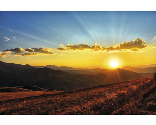 Obraz Decopanel Krajina 50 x 90 cm Horská krajina pri západe slnka s miernymi kopcami a teplým svetlom