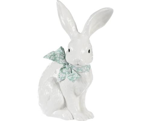 Dekoratívny biely zajac s mašľou ako veľkonočná dekorácia