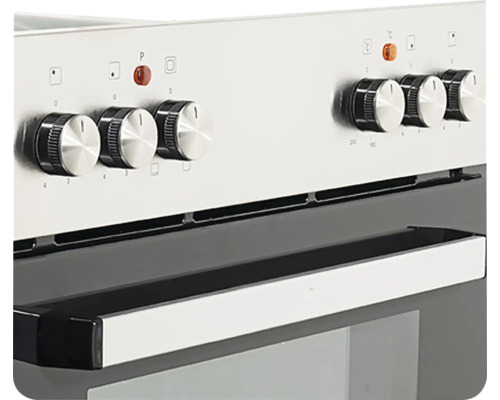 Detailný záber sporáka s otočnými gombíkmi