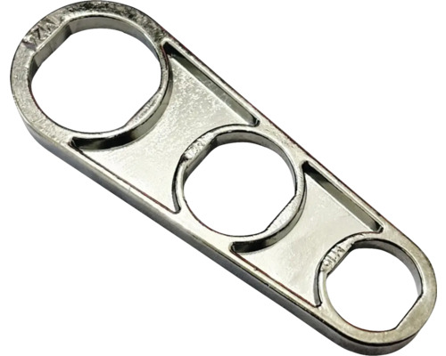 Kovový nástroj s tromi okrúhlymi otvormi