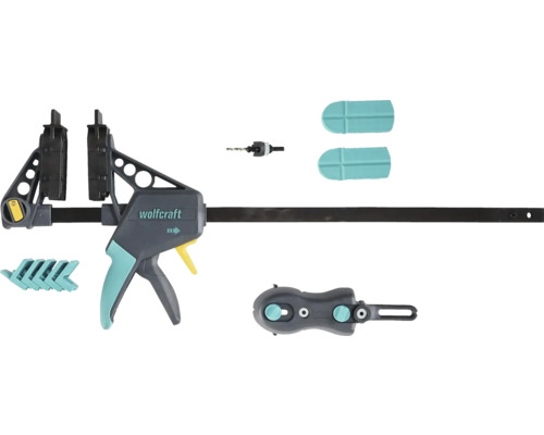 Súprava na pokládku terasy Wolfcraft, 6988000 Jednoručná zvierka Wolfcraft so sadou príslušenstva obsahujúcou vrták, ochranné krytky a adaptéry.