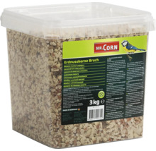 Drvené arašidy Mr. Corn v priehľadnom obale s informáciami o produkte a logom.