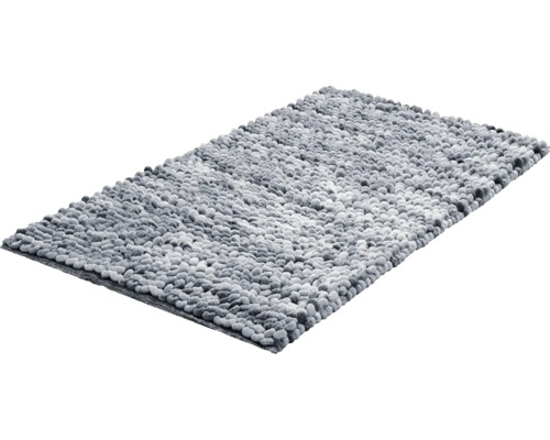 Obdĺžniková kúpeľňová predložka s mäkkým vzhľadom okruhliakov z textilných nopkov.