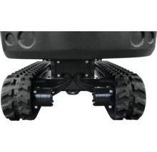 Podvozok minibagra s čiernymi gumovými pásmi a hydraulickým pohonom.