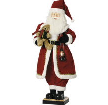Vianočná figúrka stojaci Santa Claus s medvedíkom a osvetleným lampášom v červenom rúchu s bielym kožušinovým lemom.