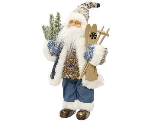 Dekoratívna figúrka Santa Clausa s lyžami, okuliarmi a jedľovou vetvou, v pletenom svetri, modrom kabáte a nohaviciach s bielym kožušinovým lemom.