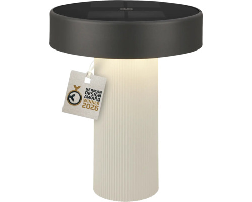 Valcová solárna stolná lampa s bielou rebrovanou základňou a tmavou hornou časťou, pečať German Design Award Winner 2026.