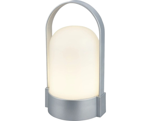 Prenosná LED stolná lampa s bielym plastovým difúzorom a strieborným kovovým držadlom.