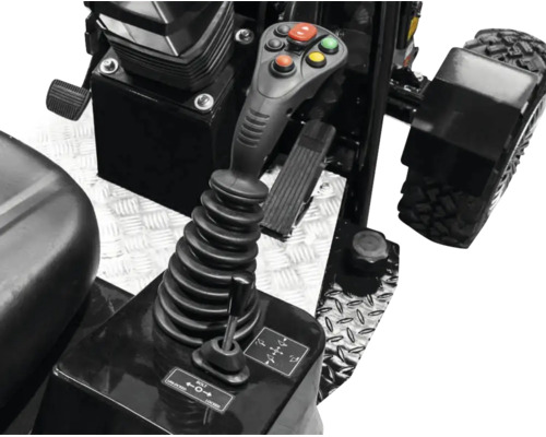 Ovládacie prvky stavebného stroja s multifunkčným joystickom, tlačidlami a zaisťovacou pákou na ryhovanom plechu.