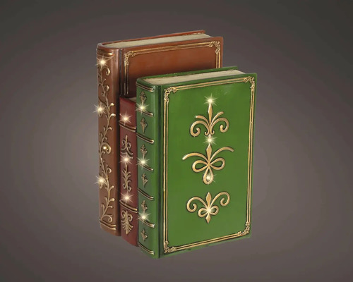 Tri dekoratívne knihy vo vintage štýle so zlatými ornamentmi a teplým bielym LED osvetlením.