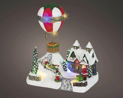Vianočná miniatúrna dedinka s LED osvetleným teplovzdušným balónom, zasneženými domami, Mikulášom a elfmi.