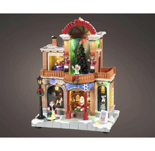 Osvetlený vianočný obchod s hračkami s figúrkami, vianočným stromčekom, luskáčikmi a nápisom Merry Christmas pre vianočné dedinky.