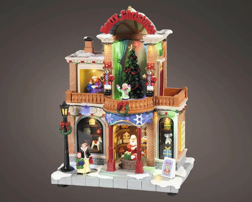 Osvetlený vianočný obchod s hračkami s figúrkami, vianočným stromčekom, luskáčikmi a nápisom Merry Christmas pre vianočné dedinky.