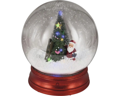 Snežná guľa s postavou Santa Clausa, zdobeným vianočným stromčekom, rebríkom a LED osvetlením na červenom podstavci.