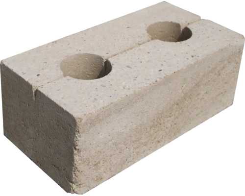 Betónová murovacia tvárnica s dvoma okrúhlymi otvormi na hornej strane.