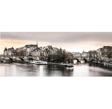 Panoramatický nástenný obraz Paríža so Seinou, mostom Pont Neuf a historickými budovami za súmraku.