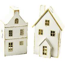 Dva dekoratívne miniatúrne domčeky z kovu v bielej farbe so zlatými okrajmi a okennými rámami.