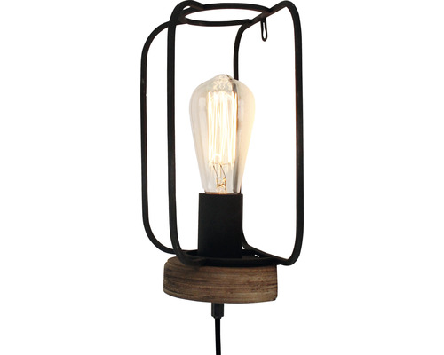Stolná lampa s kovovým rámom a žiarovkou Edison.