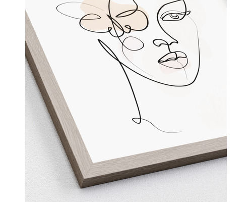 Zarámovaný obraz s abstraktným zobrazením ženy