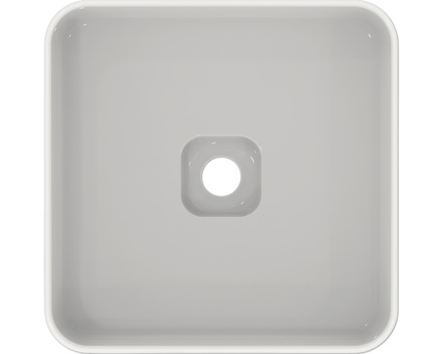 Pohľad zhora na štvorcové keramické umývadlo na dosku s odtokom