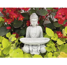 Figúrka Budhu s miskou uprostred kvetov a listov