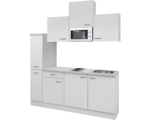 Biela kuchynská linka s mikrovlnnou rúrou, drezom a varnou doskou