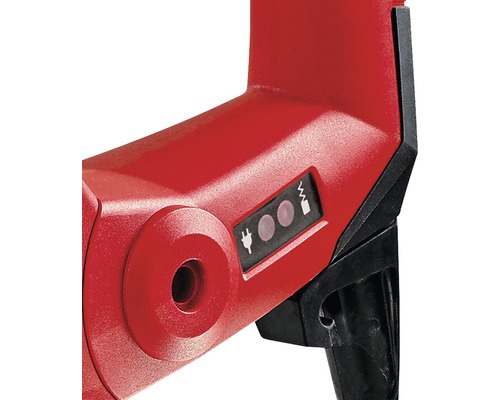 Detail červenej vŕtačky so symbolmi pre prúd a napätie