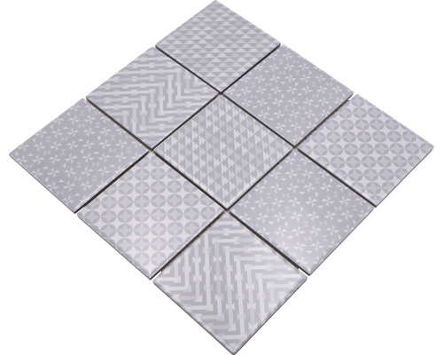 Vzor štvorcových dlaždíc s rôznymi geometrickými motívmi
