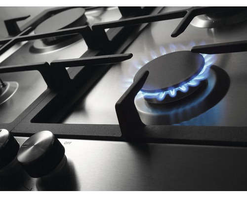 Detail plynového sporáka s horiacim plameňom