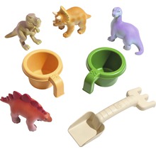 Sada hračiek s figúrkami dinosaurov, poháre a lopatkou