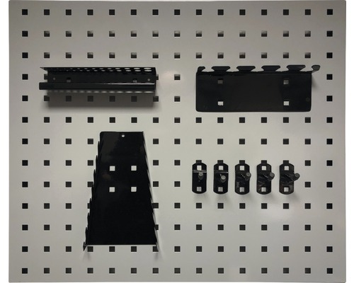 Dierovaná stena na náradie s rôznymi držiakmi na náradie