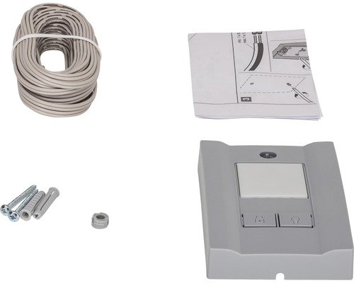 Komponenty pre pohon garážových vrát: kábel, návod, skrutky, hmoždinky a riadiaca jednotka